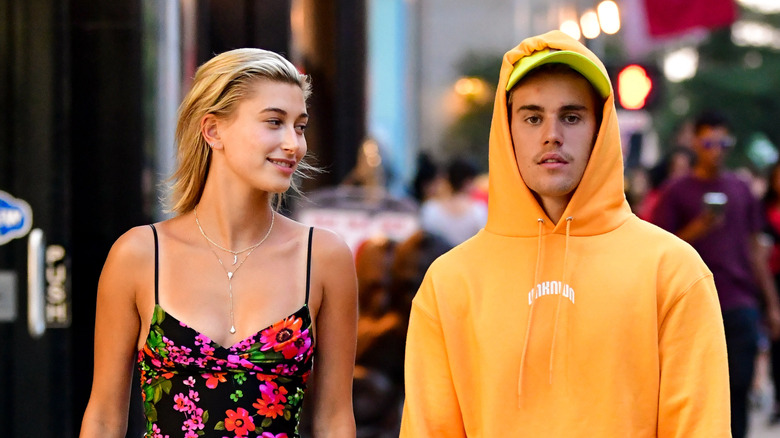 Hailey Bieber looking at Justin Bieber while walking through Manhattan