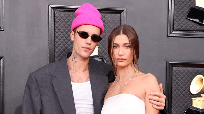 Justin Bieber with arm around Hailey Bieber at the Grammys