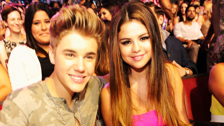 Justin Bieber with Selena Gomez sitting in the audience