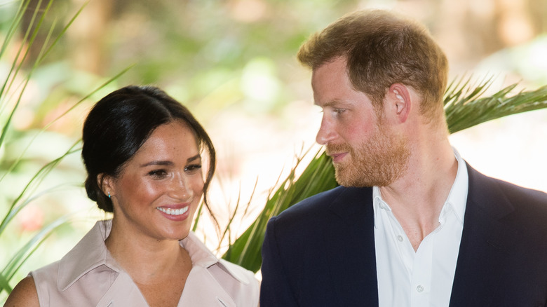 Prince Harry and Meghan Markle sharing a loving look