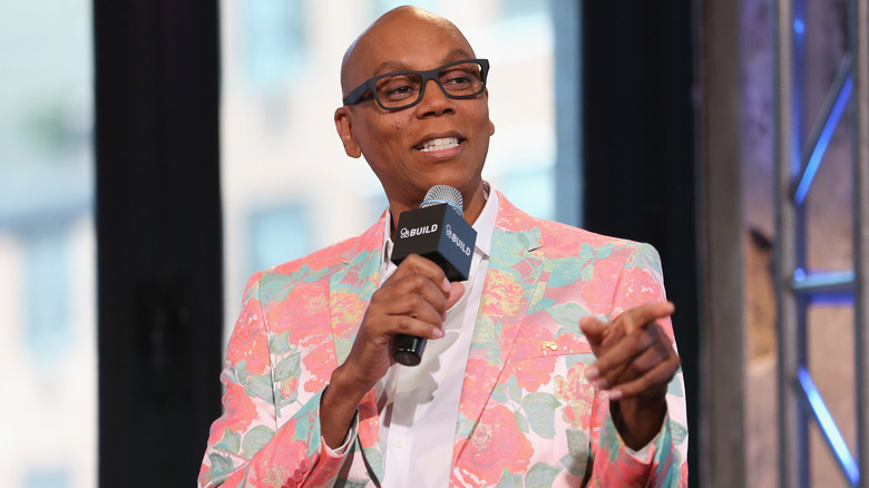 RuPaul Charles pointing during an interview