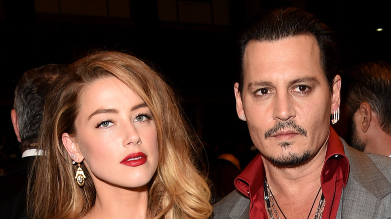 Amber Heard and Johnny Depp posing