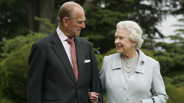 Prince Philip and Queen Elizabeth pose for the camera.