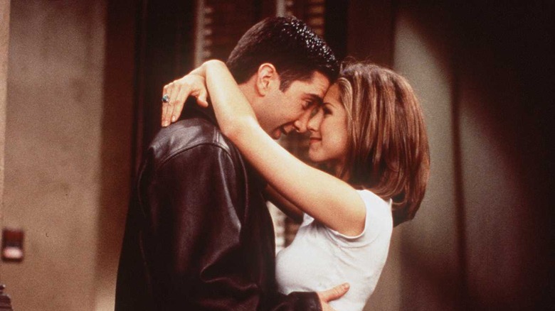 Jennifer Aniston and David Schwimmer embrace on Friends.