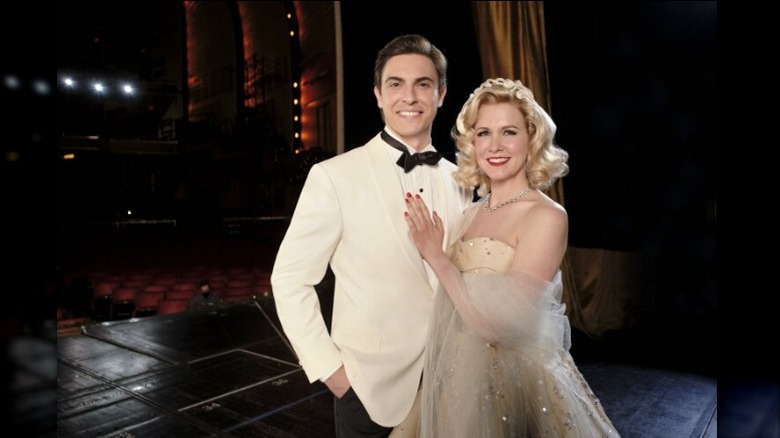 Derek Klena and Ginna Claire Mason posing on stage