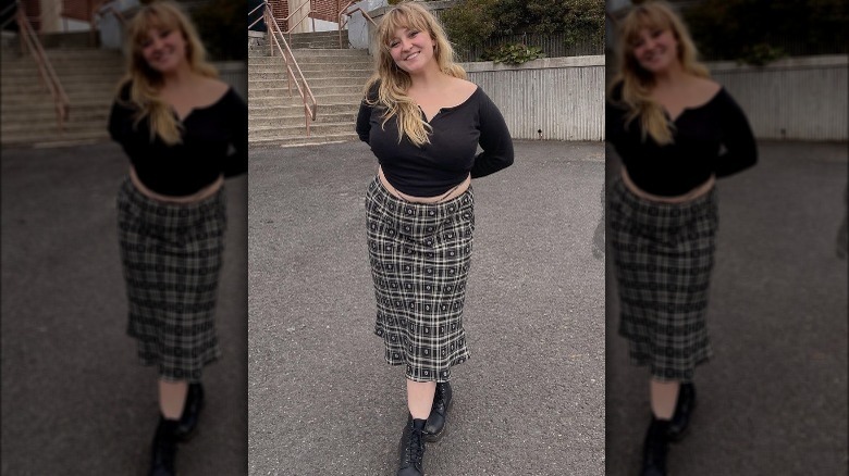 Woman smiling long patterned skirt