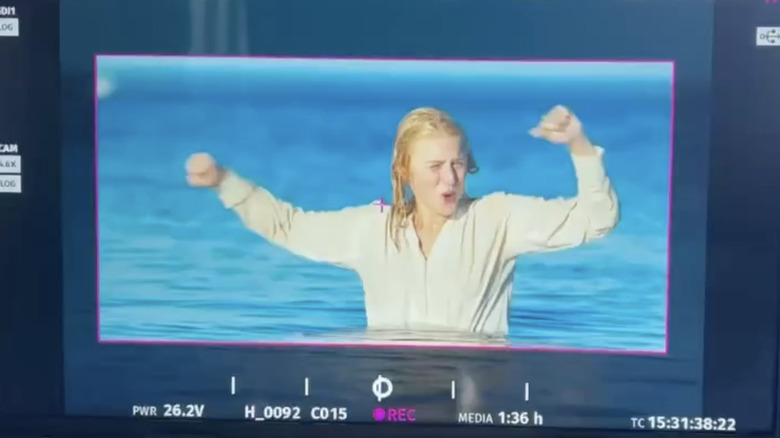 Julia Schlaepfer goofs off in the water on set of "1923"