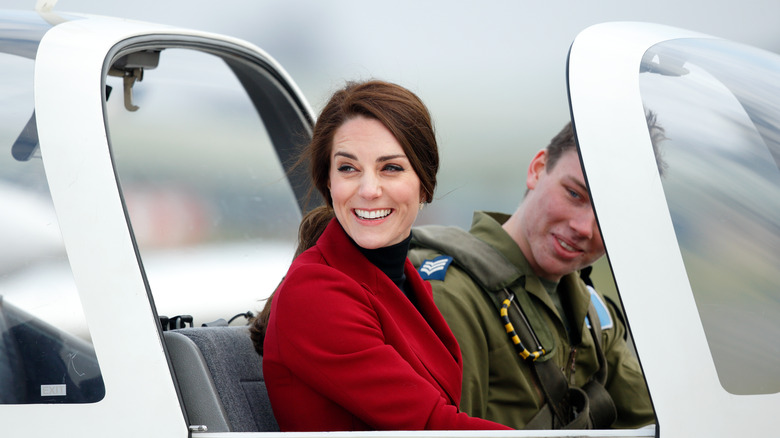 Kate Middleton riding in a jet