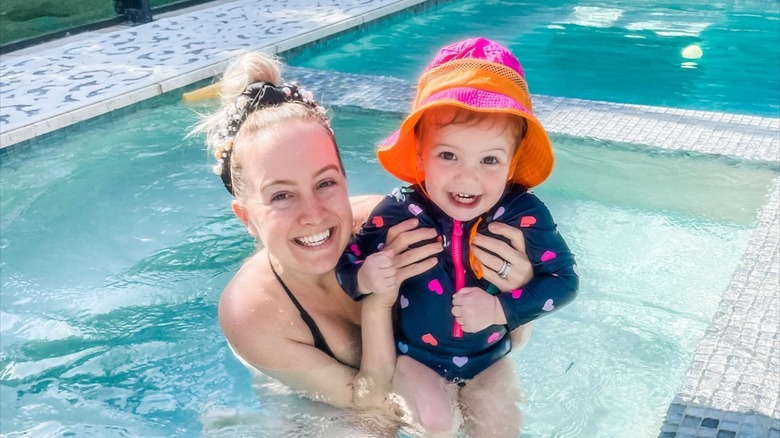 Elizabeth in the pool with her daughter Ellie