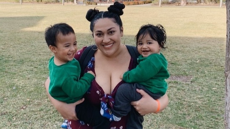 Kalani Faagata smiling with her sons 