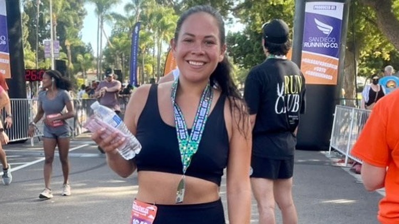 Liz Woods smiling at finish line 