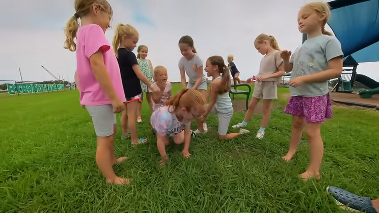 Busby girls playing in the park with friends