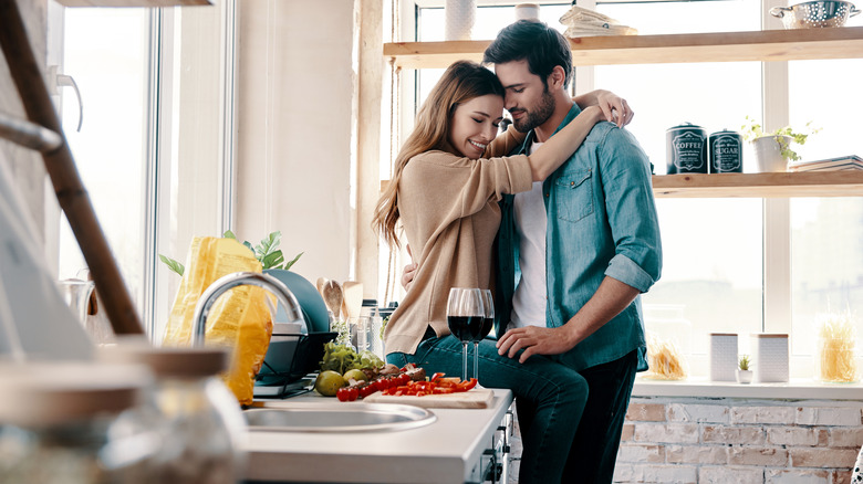 happy couple cooking before going to bed