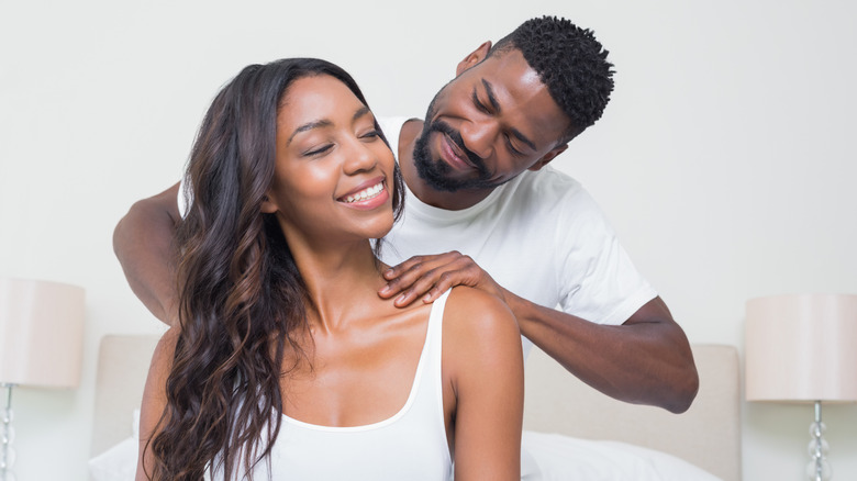 happy couple giving a massage before going to bed