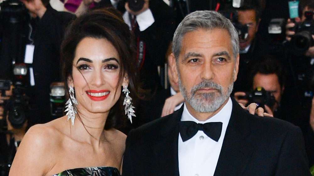 George and Amal Clooney posing