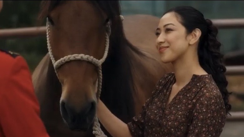 Mei Suo smiling with horse