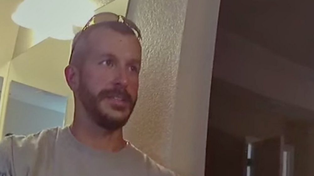 Chris Watts kissing Nichol Kessinger on the cheek, both of whom appeared in American Murder: The Family Next Door