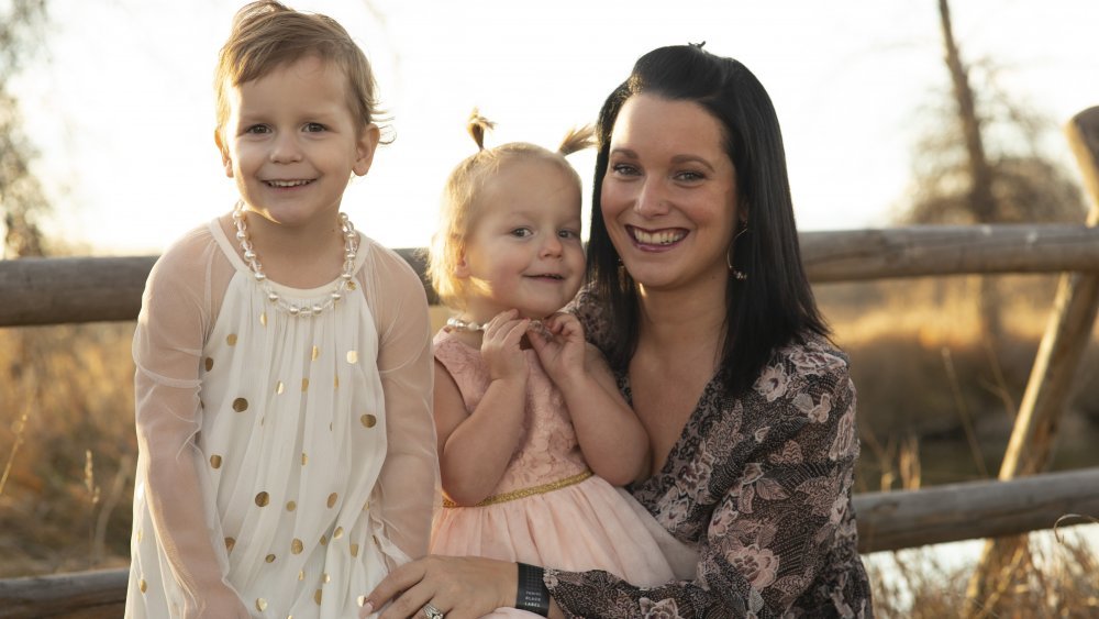 Shanann Watts and her two children outside, the subjects of American Murder: The Family Next Door