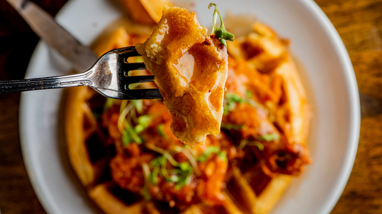 chicken and waffles on plate with fork