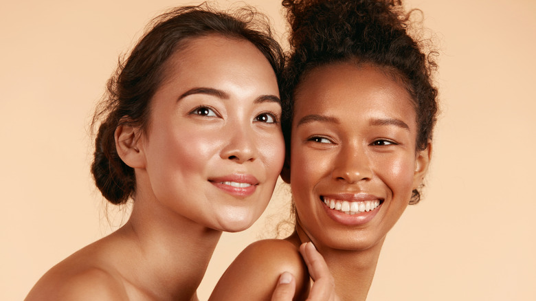 Two women with dewy skin