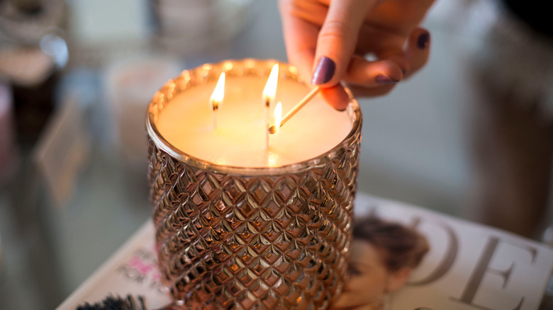 Woman lighting candle