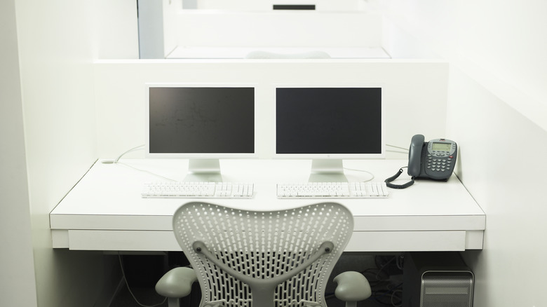 Desk with two computer screens