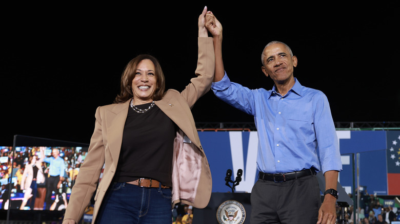 Barack Obama standing with Kamala Harris