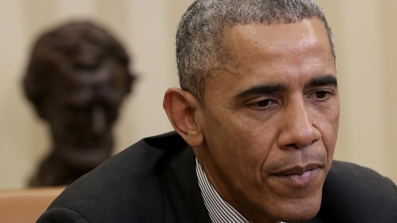 A closeup of Barack Obama looking serious 