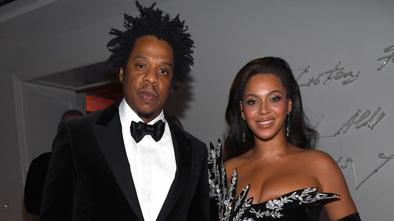 Jay-Z and Beyoncé dressed in black formalwear