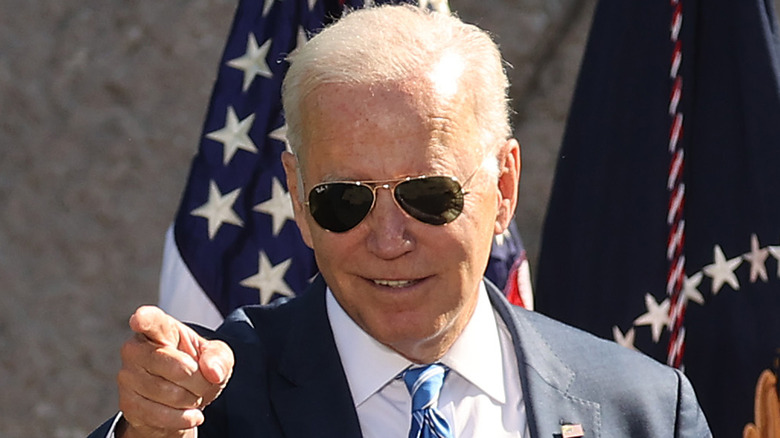 President Joe Biden grinning and pointing