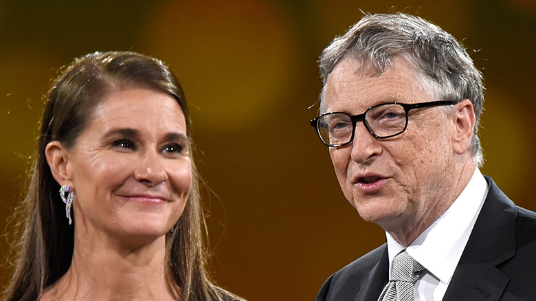 Melinda and Bill Gates speak onstage at an event together