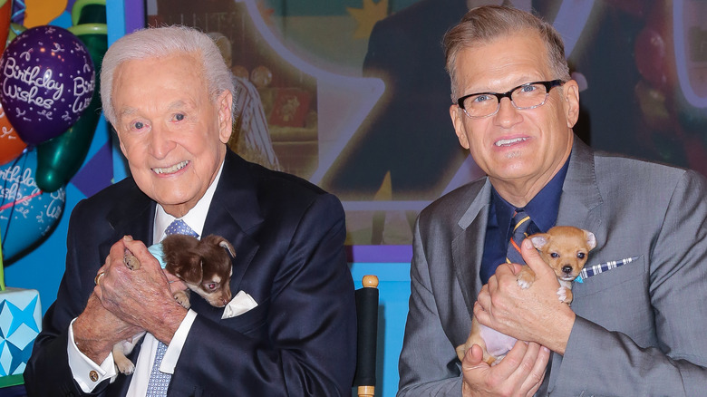 Bob Barker and Drew Carey holding puppies