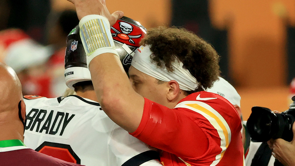 Tom Brady and Patrick Mahomes embracing after Super Bowl