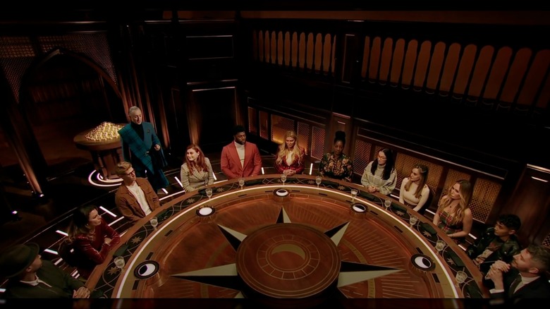 Contestants on The Traitors sitting around a table