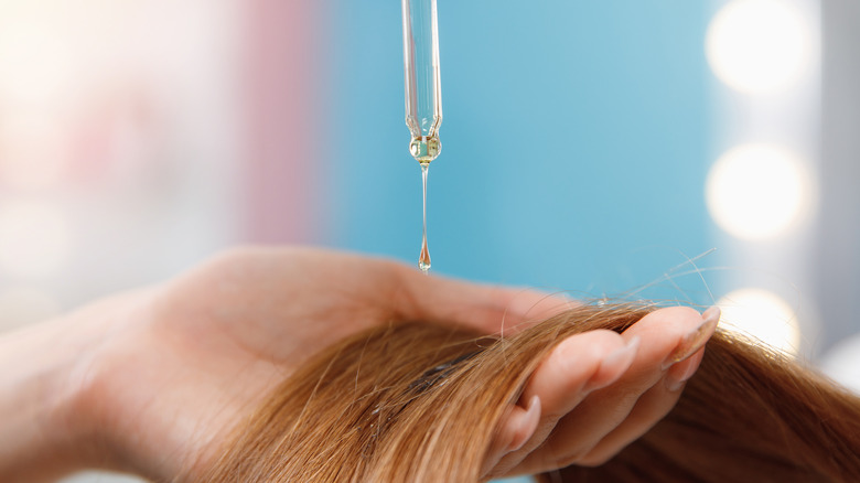 Applying oil to hair