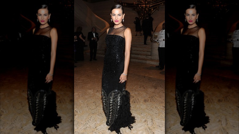 Camilla Belle posing in evening gown