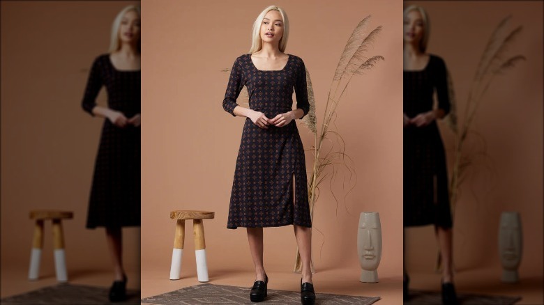 known supply model posing knee-length dress