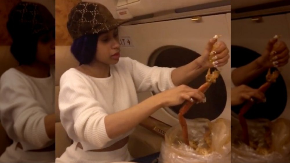 Cardi B eating crab legs