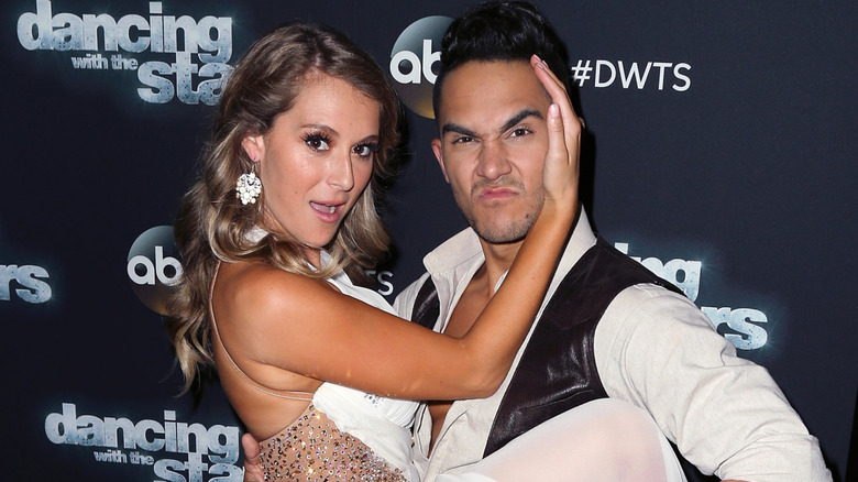 Carlos and Alexa PenaVega doing a dance pose