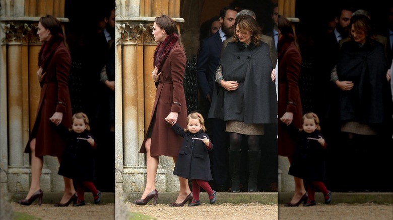 Princess Catherine holding Princess Charlotte's hand while the Middletons leave church behind them