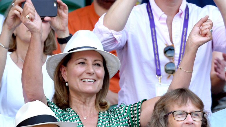 Split image of Carole Middleton and Princess Charlotte with face in hands at Wimbledon