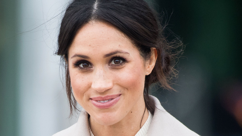 Meghan Markle smiles for photographers 