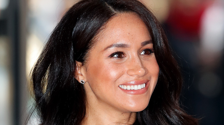 Meghan Markle smiles for photographers 