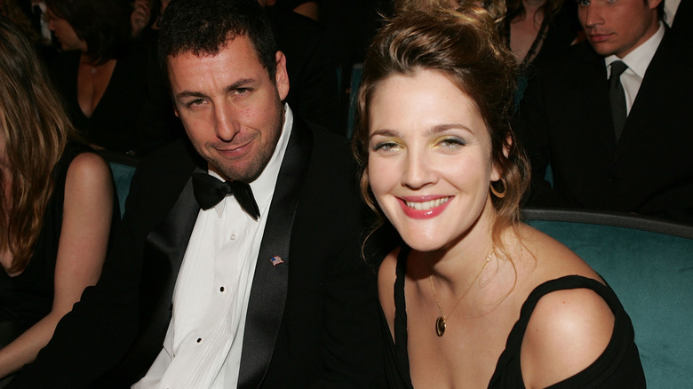 Adam Sandler and Drew Barrymore smiling at the 31st Annual People's Choice Awards on January 9, 2005, at the Pasadena Civic Auditorium.