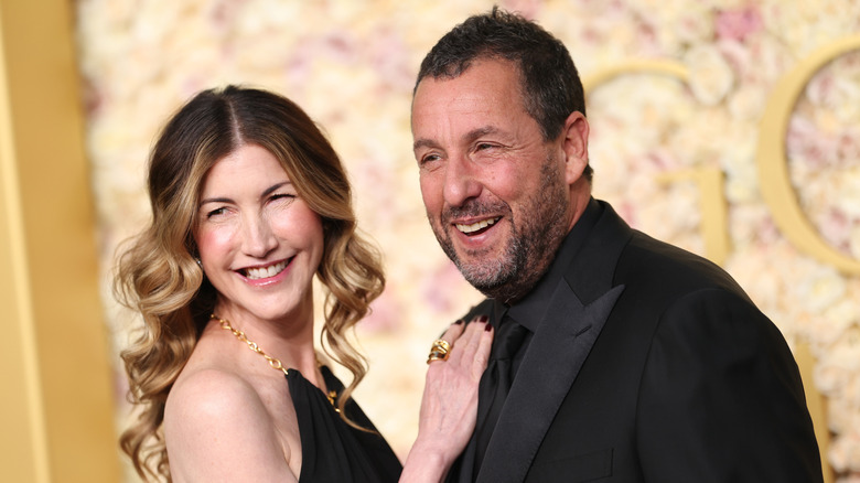 Jackie Sandler and Adam Sandler posing at 82nd Annual Golden Globe Awards at The Beverly Hilton on January 05, 2025 in Beverly Hills, California