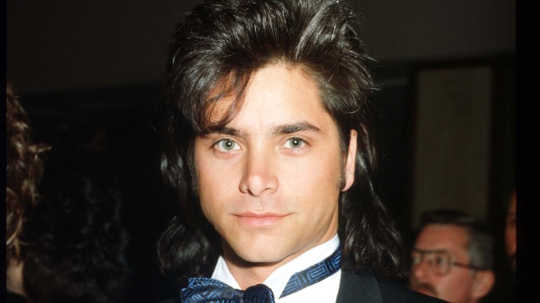 Young John Stamos poses for a photo