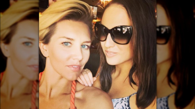 Charissa Thompson at the beach with a friend makeup-free