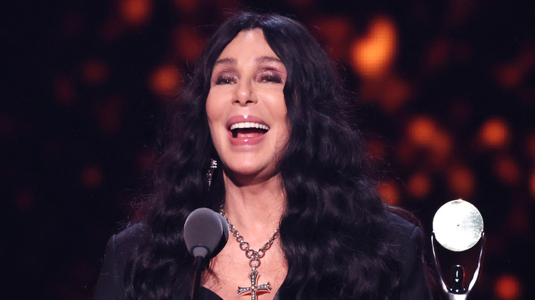 Cher receiving an award at the 2024 Rock and Roll Hall of Fame Induction ceremony