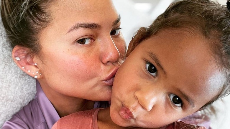 Chrissy Teigen makeup free with her daughter Luna