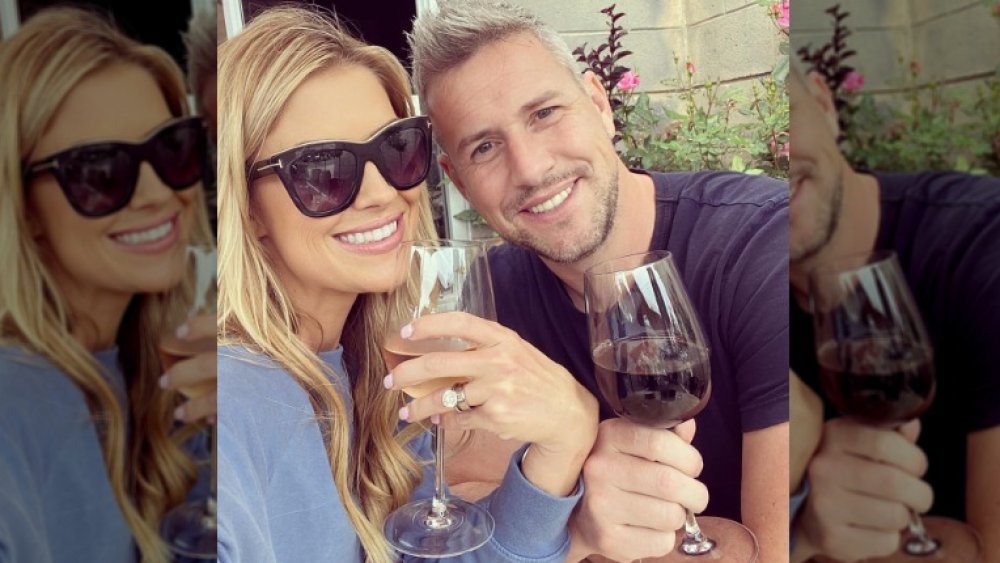 Christina Anstead and her partner drinking wine together